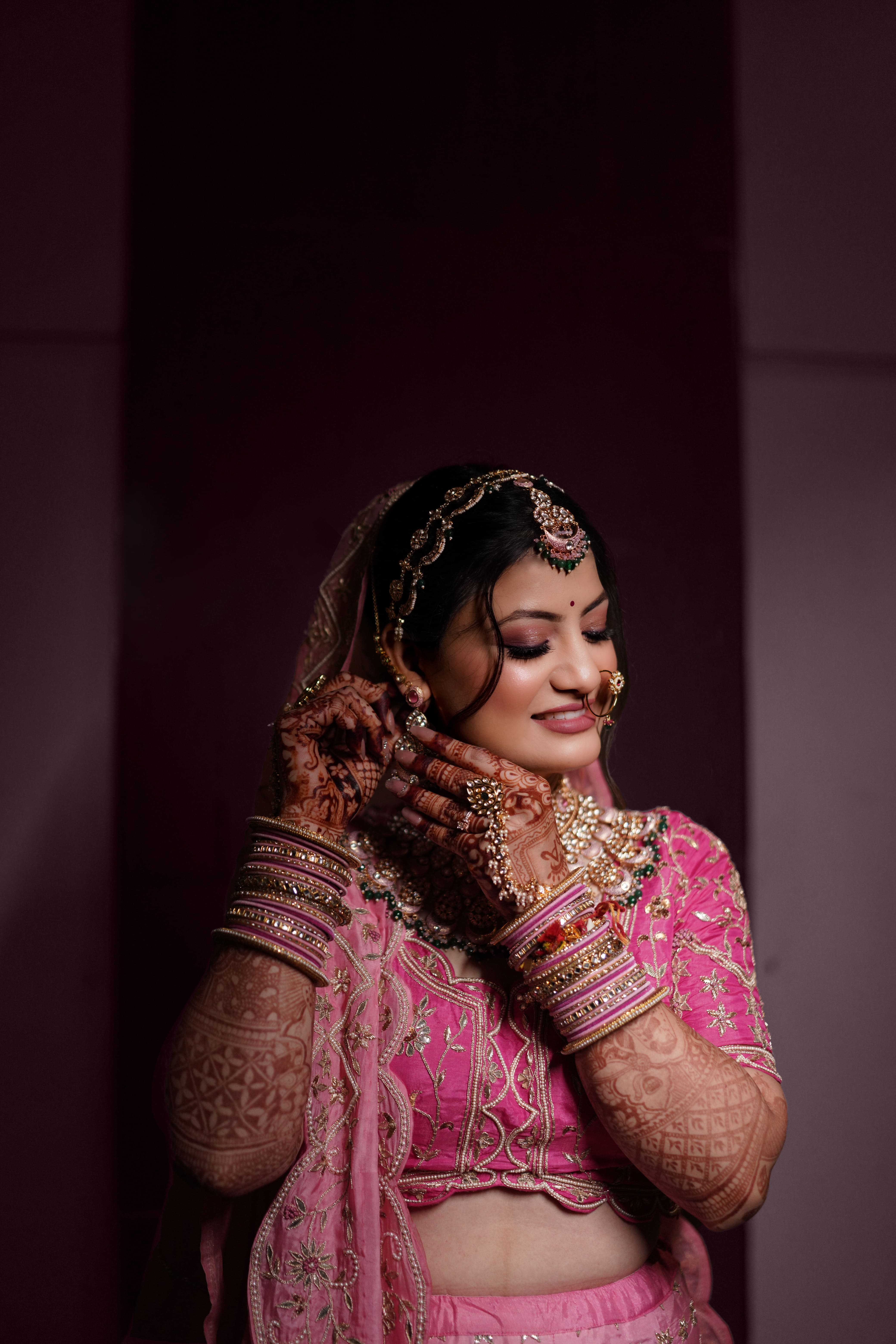 A stunning bridal portrait featuring the bride in elegant attire, captured by Fotographiya